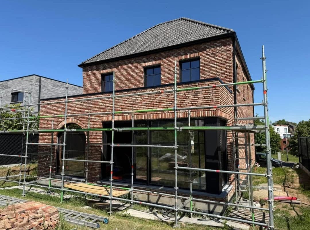 Construction worker installing wooden beams